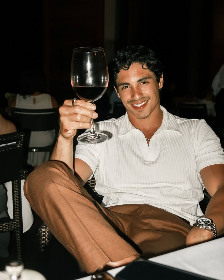 Professional man with wine at an upscale London venue